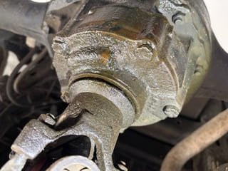 Car mechanic inspecting and repairing brake components for safe driving performance