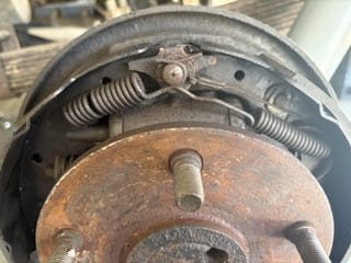 Mobile mechanic handling urgent roadside car breakdown with professional tools