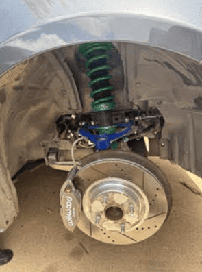 Auto repair specialist running diagnostic scan to detect engine issues accurately